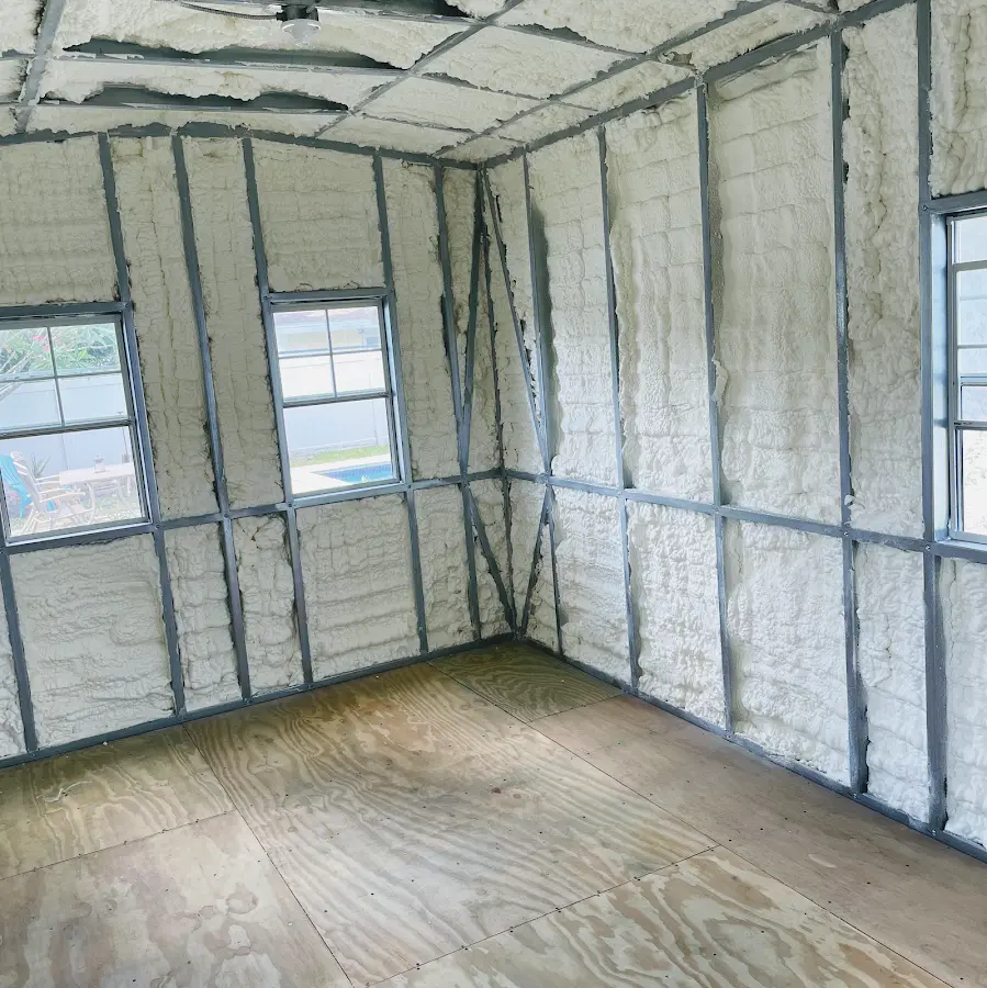 Closed-cell spray foam insulation applied to wall cavities in a residential project in Manville